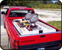 Bass Baby - Two man fishing boat in a truck